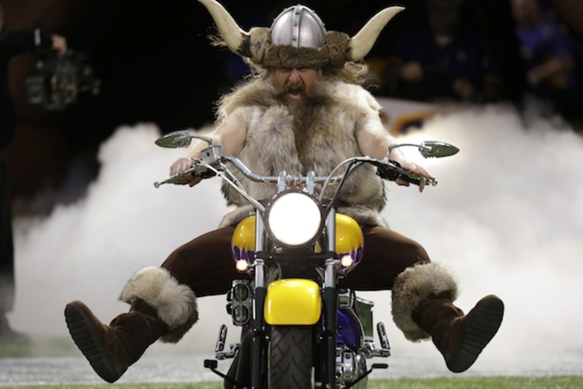 Ragnar rides out of the tunnel on his trademark purple motorcycle. 