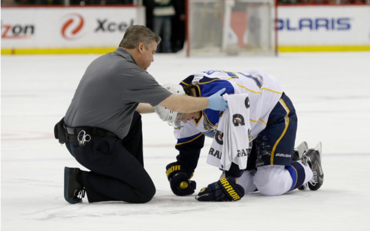 St. Louis Blues right wing T.J. Oshie needs help off of the ice after being injured.  (AP Photo/Ann Heisenfelt)