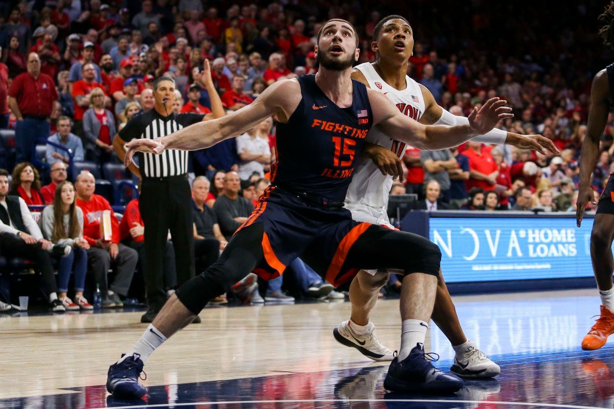 Illinois forward Giorgi Bezhanishvili (15) tries to block out Arizona forward Ira Lee (11) during a NCAA Basketball game between the Illinois Fighting Illini and the Arizona Wildcats at McKale Center.