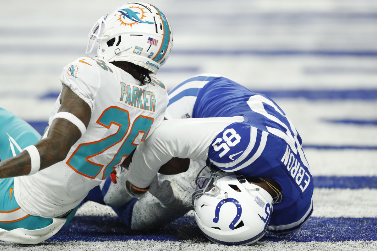 Colts tight end Eric Ebron is unable to hold onto the football for a touchdown reception as Dolphins safety Steven Parker grabs it away for an interception Sunday at Lucas Oil Stadium.