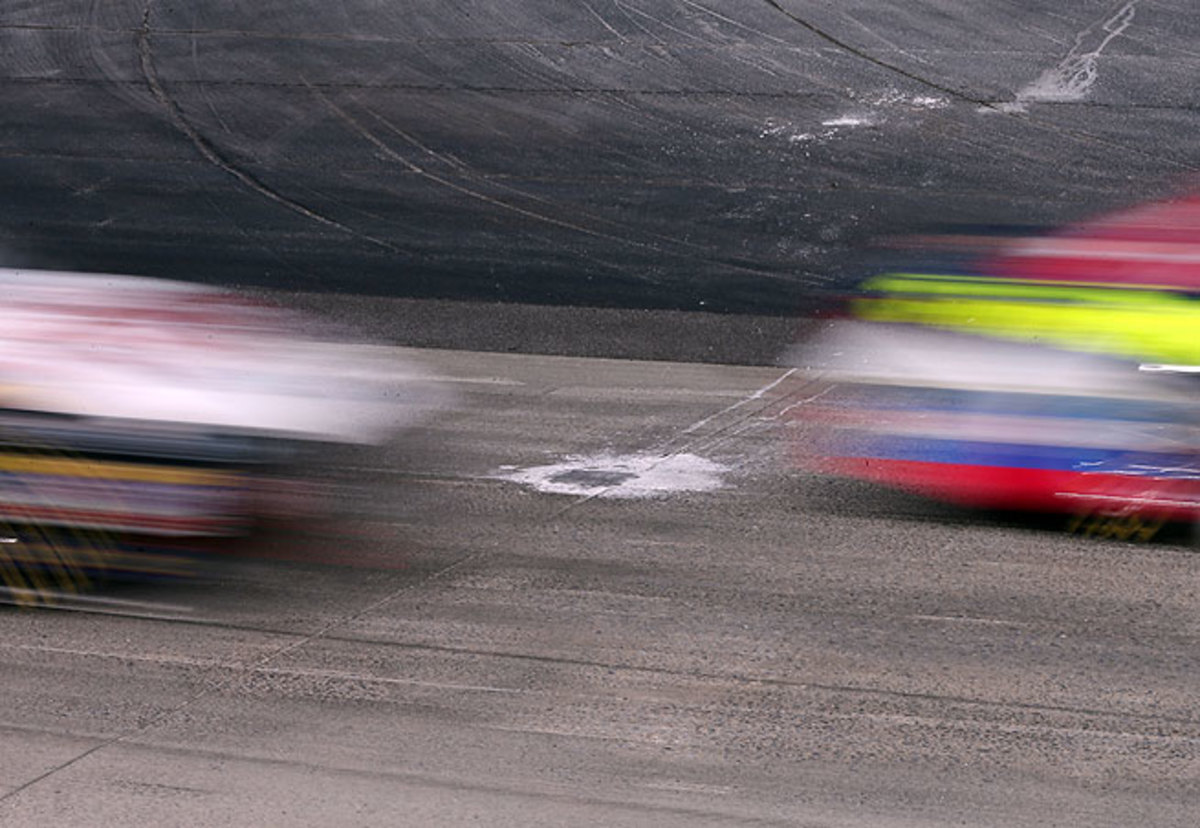 Potholes in the concete track at Dover International Speedway needed to be repaired before Sunday's NASCAR Sprint Cup race could resume.