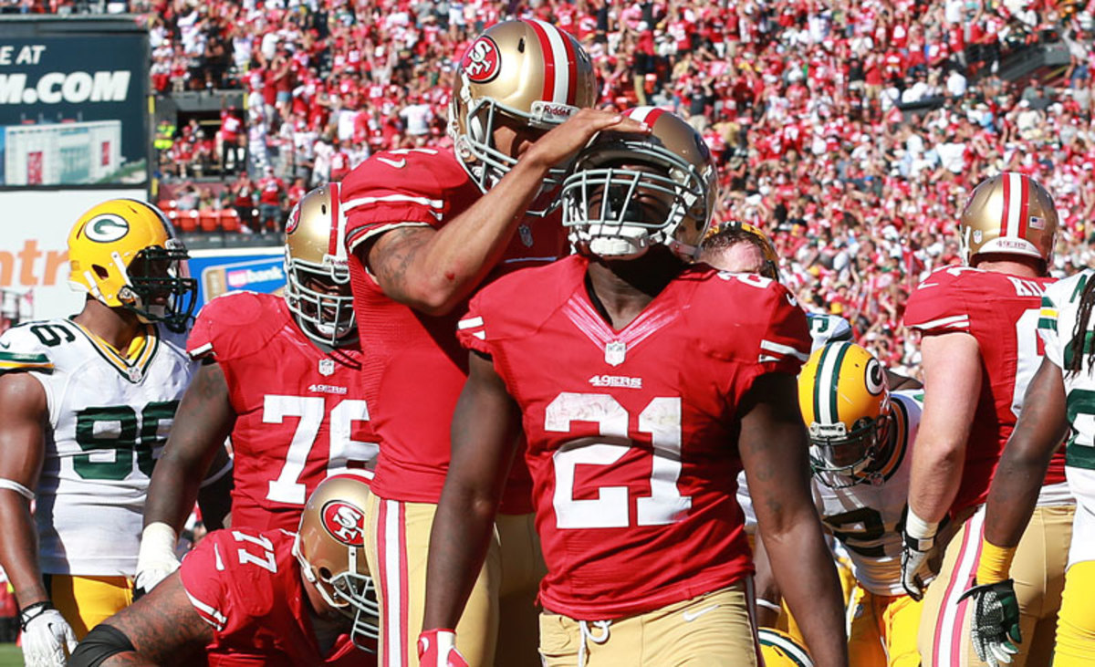 Colin Kaepernick and Frank Gore are two of the 49ers wild-card-round high eight purple-chip players. (Tom Hauck/AP)