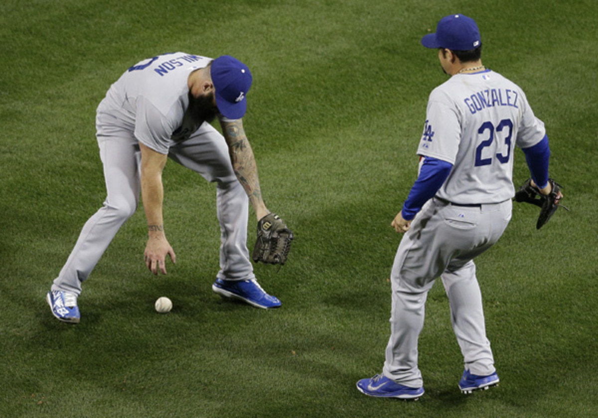 Brian Wilson's implosion, including a fielding error (pictured), allowed the Padres to take the lead. (Gregory Bull/AP)