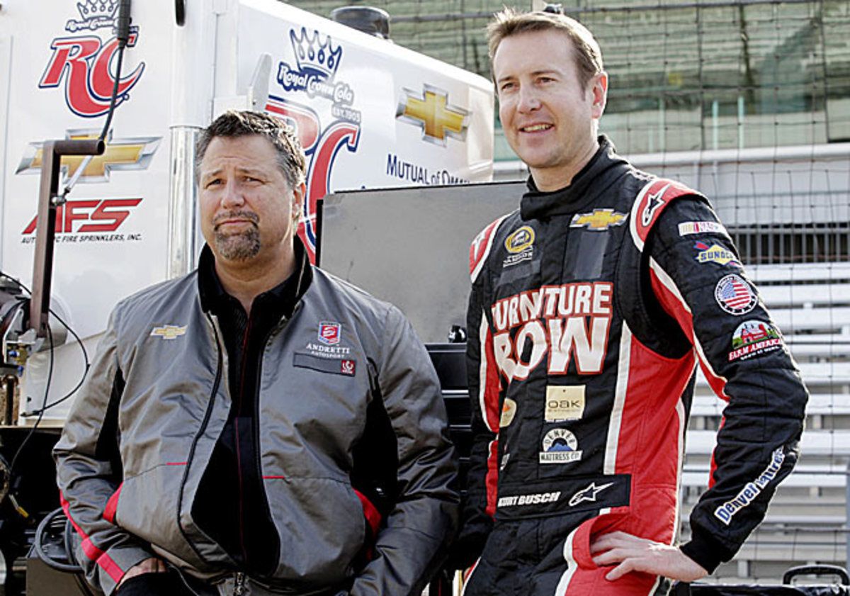 Kurt Busch completed an Indy 500 rookie program with team owner Michael Andretti (left) last year.