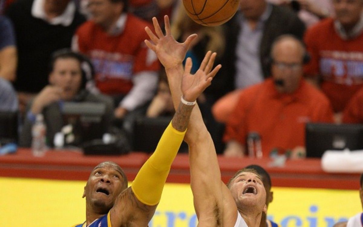 os Angeles Clippers Blake Griffin (R) and Golden State Warriors Marreese Speights (L) compete for a jump ball during Game Two of their NBA Western Conference first-round series playoffs at the Staples Center in Los Angeles California April 21, 2014. AFP PHOTO / ROBYN BECK (Photo credit should read ROBYN BECK/AFP/Getty Images)