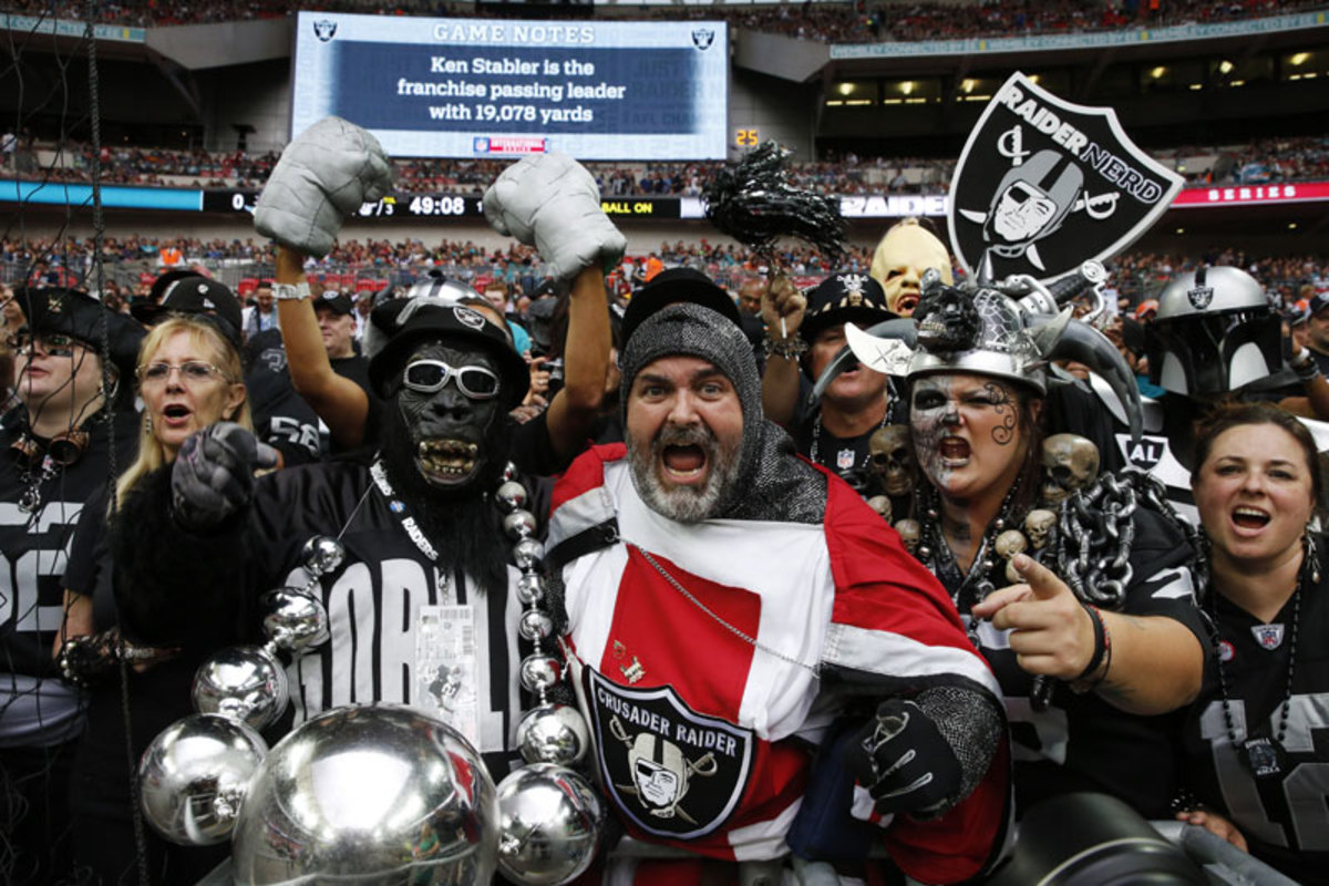 Cultures clashed in good fun in the stands at Wembley, but sporting differences between U.S. and U.K. sports run deep. (Lefteris Pitarakis/AP)