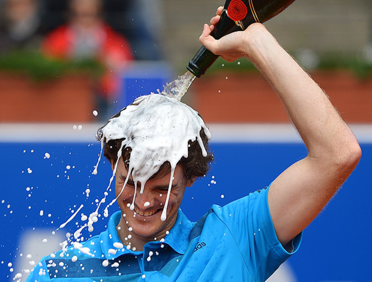 Jamie Murray gives himself a champagne shower after winning the doubles title with John Peers at the BMW Open. (Dennis Grombkowski/Getty Images)