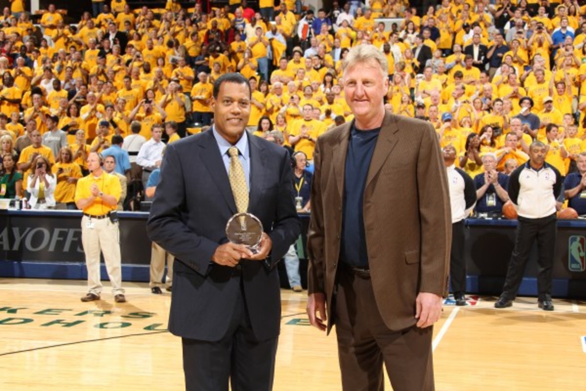 Stu Jackson, pictured here honoring Larry Bird with Executive of the Year in 2012, hired Pistons coach and president Stan Van Gundy as an assistant at Wisconsin two decades ago. (Nathaniel S. Butler/Getty Images)