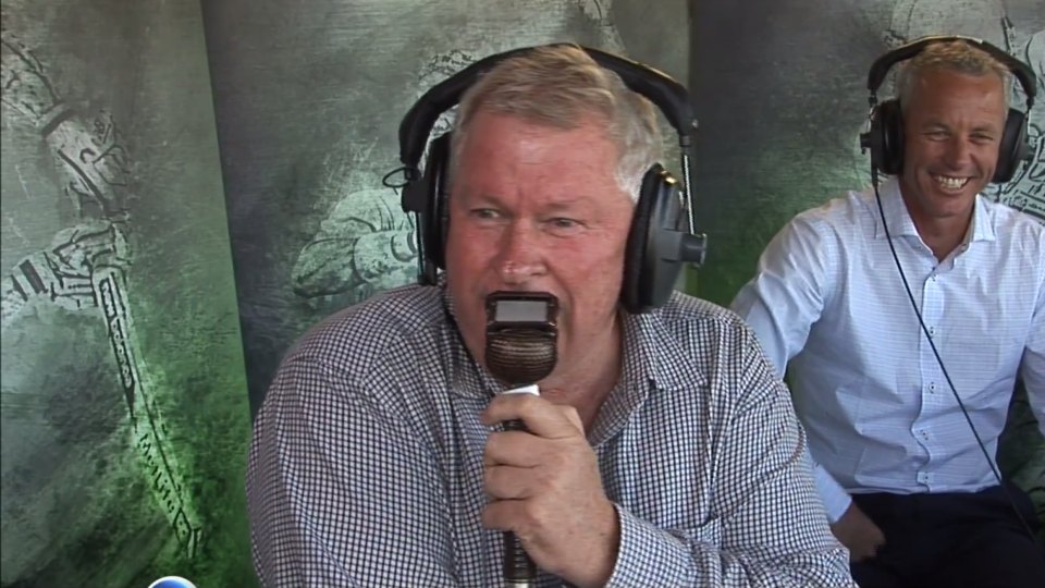 Cricket announcer looks on as ball hit out of play dents his car