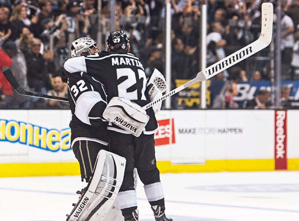 Jonathan Quick (32) and Alec Martinez helped the Kings complete another improbable comeback in Game 2. (Robert Beck/SI)