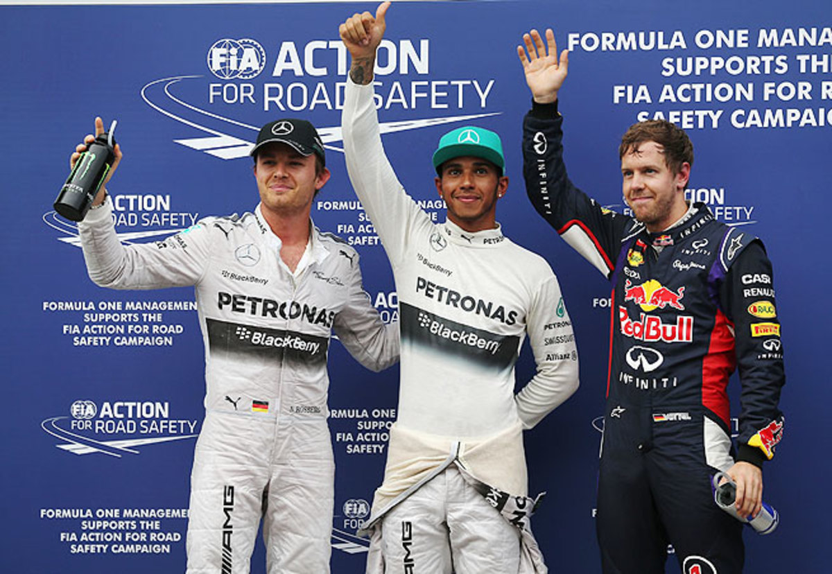 Vettel (right) blamed Rosberg (left) for his runner-up finish to Hamilton (center) in qualifying.