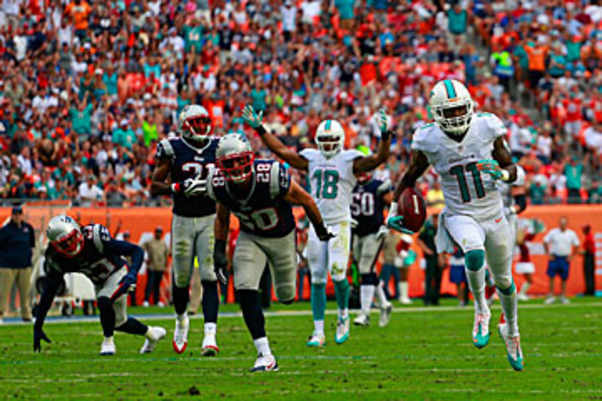 Mike Wallace on his way to the end zone last December. (Chris Trotman/Getty Images)