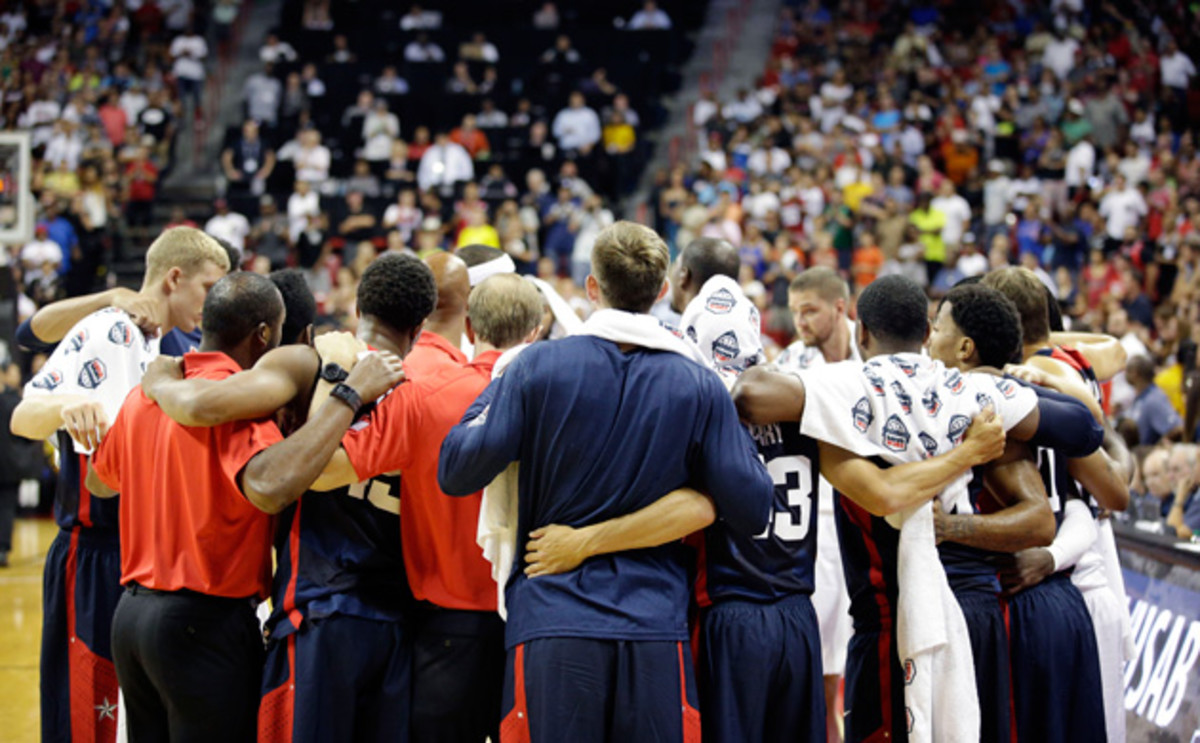 Team USA players and coaches huddle after Indiana Pacers' Paul George was injured during the USA Basketball Showcase game Friday, Aug. 1, 2014, in Las Vegas.