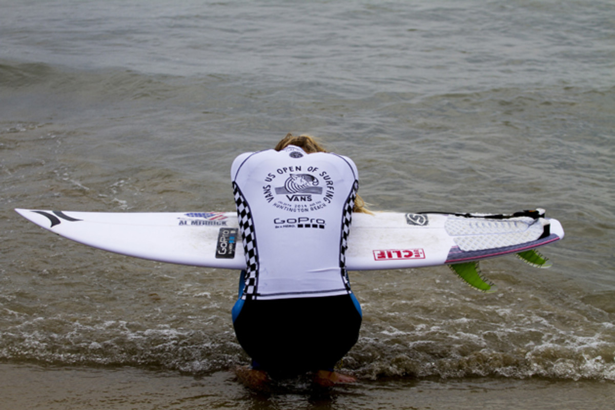 Lakey Peterson takes a moment to herself prior to surfing her quarterfinal heat at the Vans U.S. Open of Surfing. 