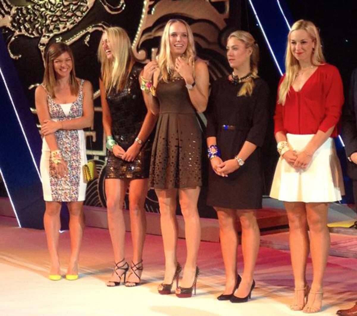 The women share a laugh at the Wuhan Open player's party. 