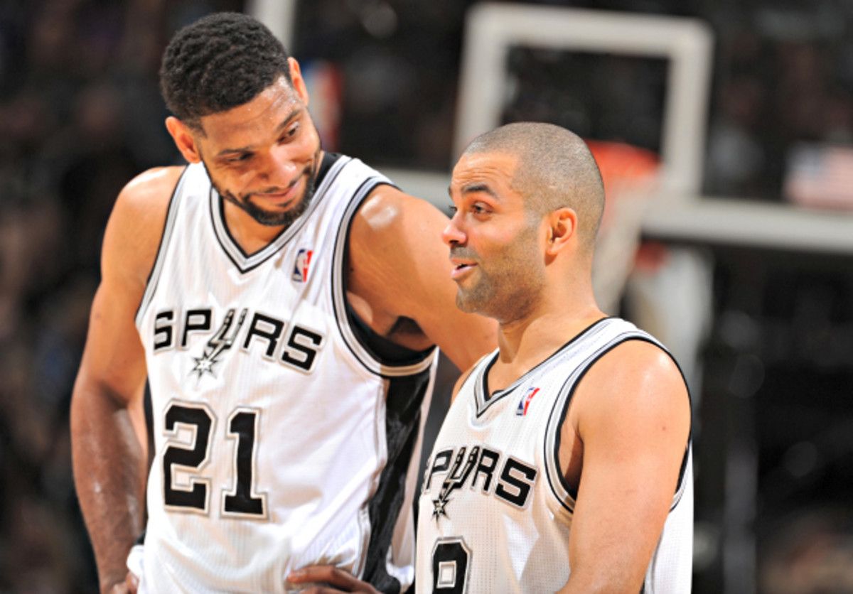 Tony Parker and Tim Duncan had no problem closing out the Mavs in Game 7. (Garrett W. Ellwood/NBAE via Getty Images)