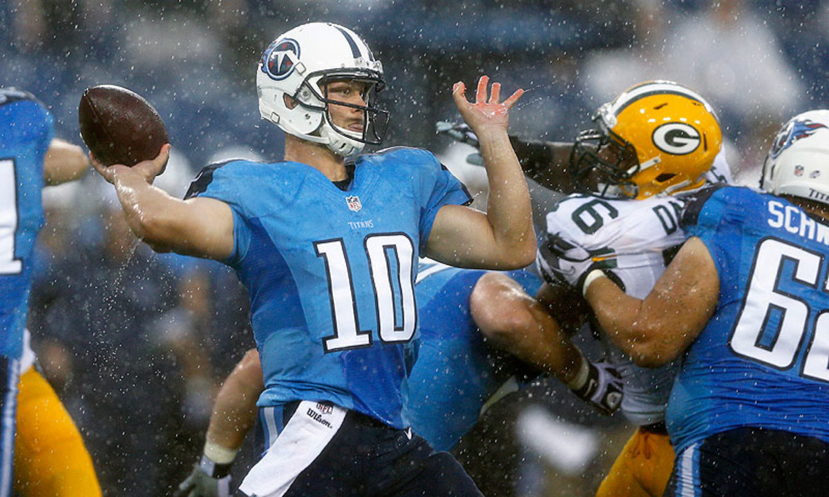 Jake Locker only threw two passes in a rain-soaked preseason debut against the Packers. (Joe Robbins/Getty Images)