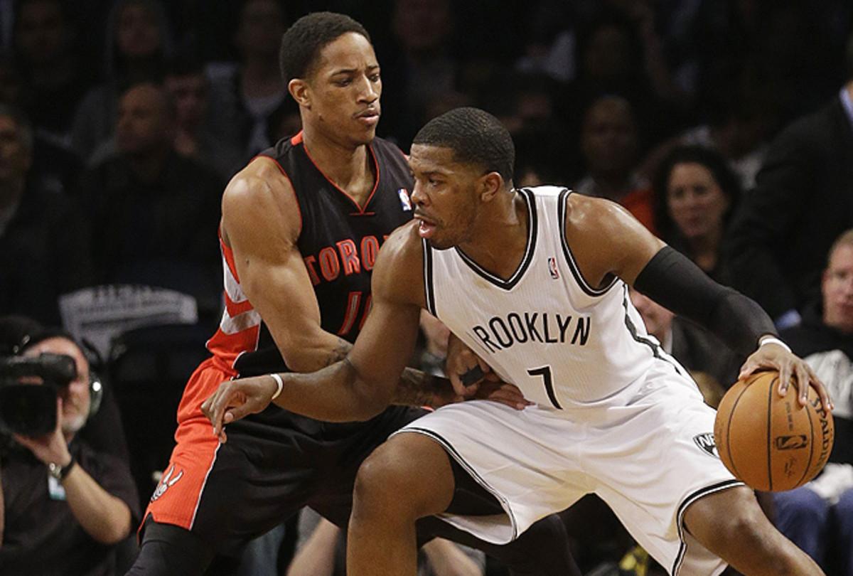 DeMar DeRozan (left) struggled to keep Joe Johnson (right) from getting to his spots in Game 3. 