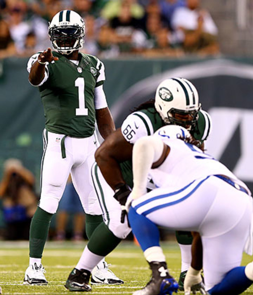 Michael Vick is competing for the starting quarterback job in Jets camp. (Elsa/Getty Images)
