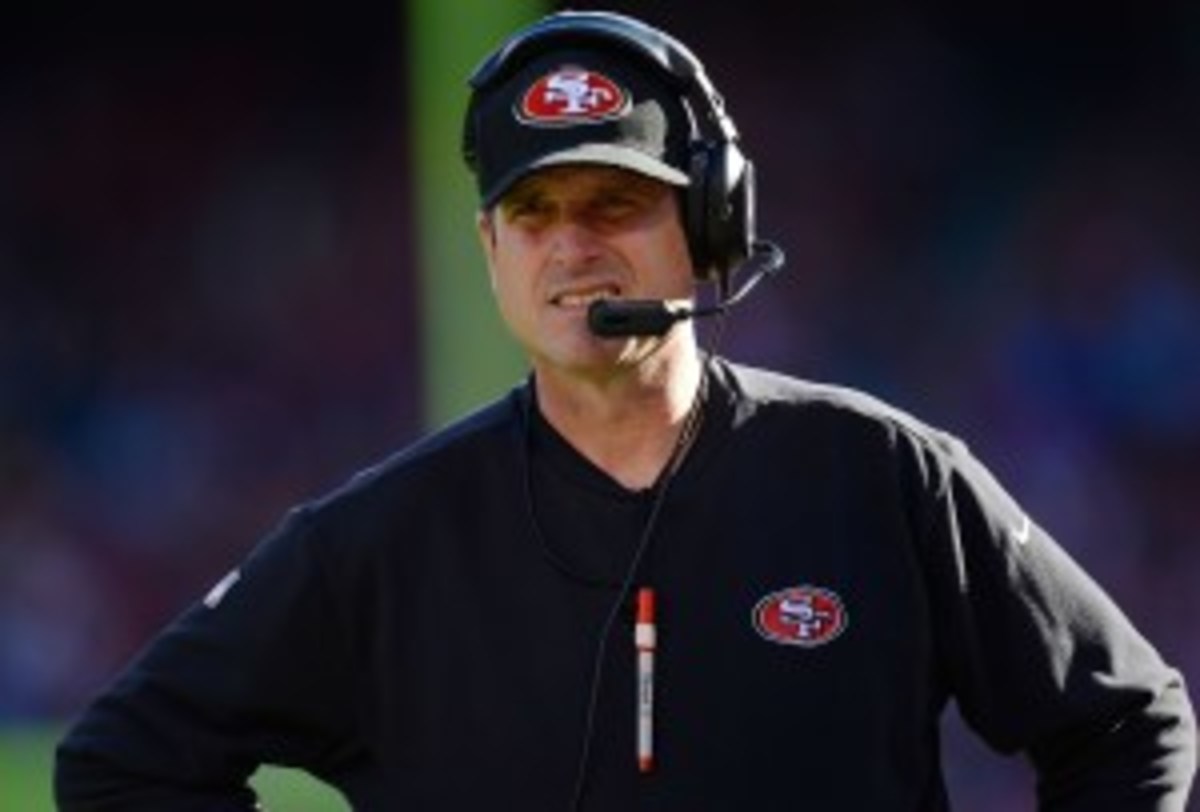 Jim Harbaugh said it's not the "49ers way" to skip camp. (Thearon W. Henderson/Getty Images)