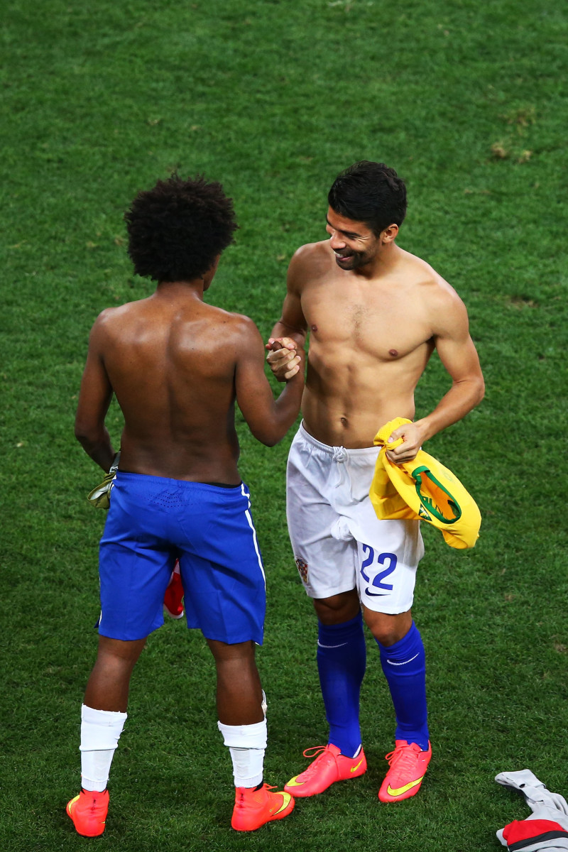 Willian of Brazil and Eduardo of Croatia swap shirts after the 2014 FIFA World Cup Brazil Group A match between Brazil and Croatia at Arena de Sao Paulo on June 12, 2014 in Sao Paulo, Brazil. (Photo by Elsa/Getty Images)