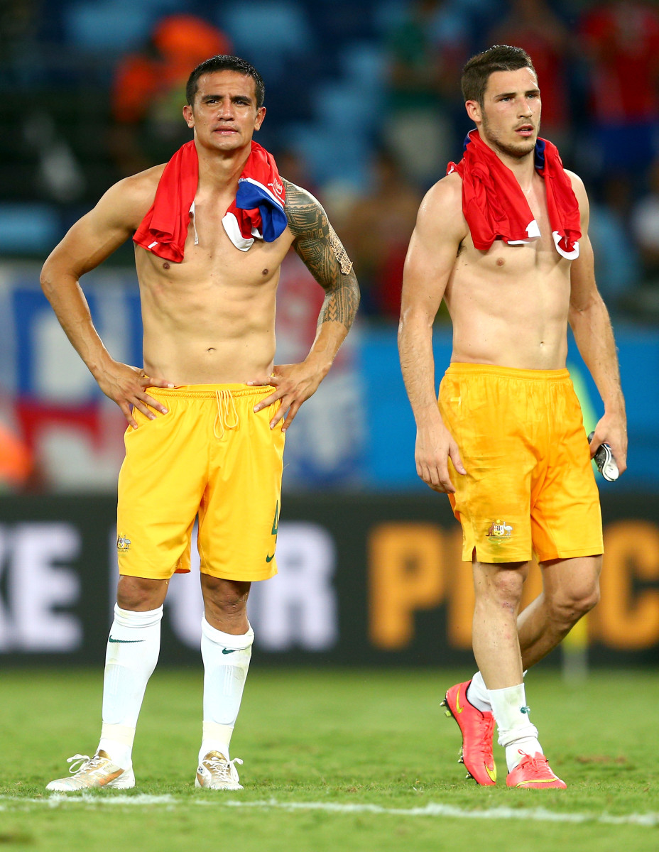  Tim Cahill of Australia (L) and Mathew Leckie of Australia show their dejection after the 2014 FIFA World Cup Brazil Group B match between Chile and Australia