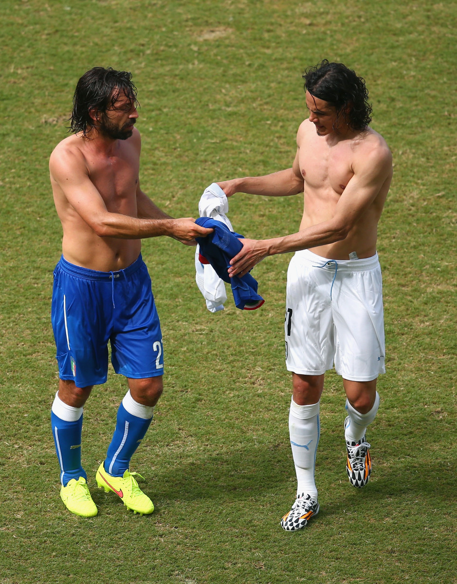 Andrea Pirlo of Italy and Edinson Cavani of Uruguay exchange jerseys during the 2014 FIFA World Cup Brazil Group D match between Italy and Uruguay