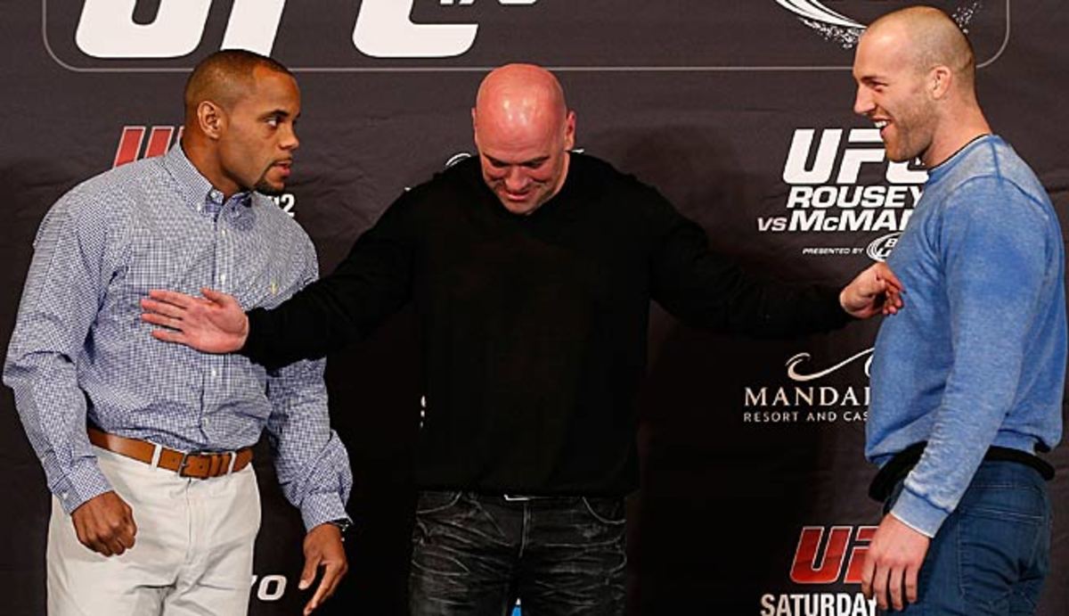 Daniel Cormier (left) and Patrick Cummins are separated by UFC president Dana White after an exchange during the final UFC 170 pre-fight press conference. 