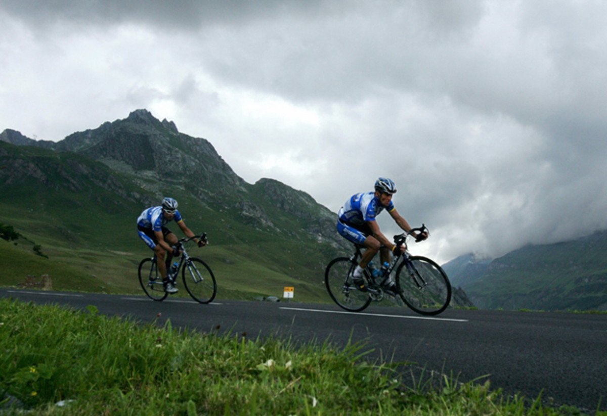 Lance Armstrong rides in front of his teammate George Hincapie during the tenth stage of the 92nd Tour de France race between Grenoble and Courchevel. Armstrong would go on to win the race for his seventh Tour de France title.