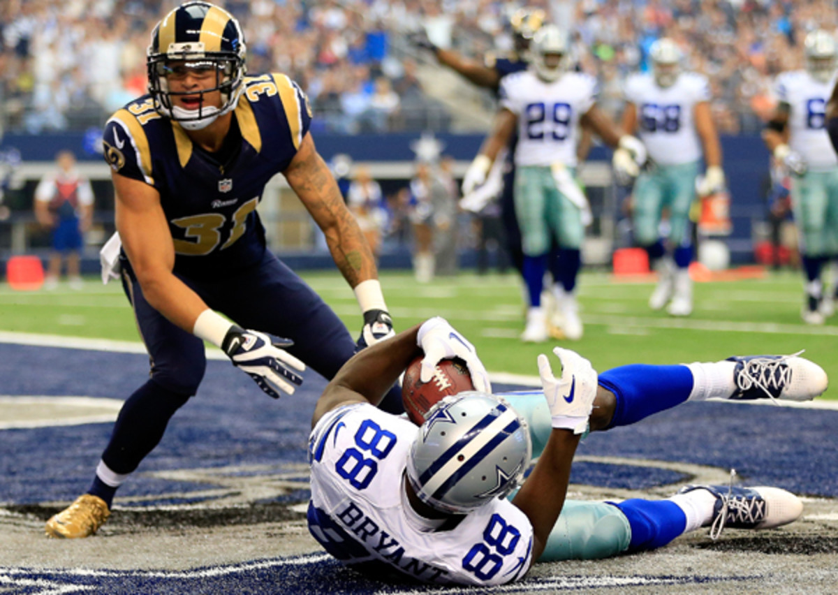 Unfortunately, this happened all too often when Cortland Finnegan was a pass defender in 2013. (Jamie Squire/Getty Images)