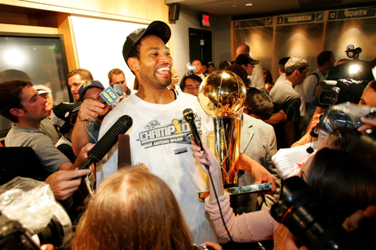 Horry holding the Larry O'Brien trophy, a familiar feeling for the clutch forward. 
