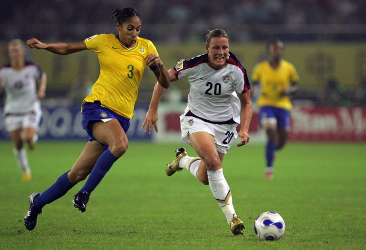 Aline Pellegrino, left, goes up against U.S. star Abby Wambach in Brazil's famous 4-0 win over the Americans in the semifinals of the 2007 Women's World Cup.