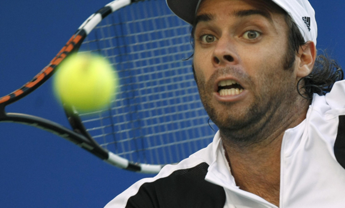 Gonzalez hits a return against Blake during their semifinal match.