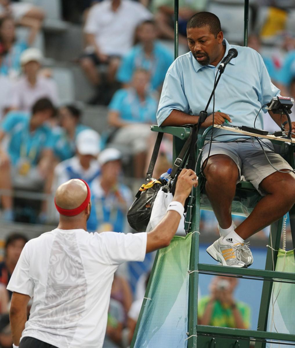 Blake discusses a call with the chair umpire during his semifinal match against Gonzalez.