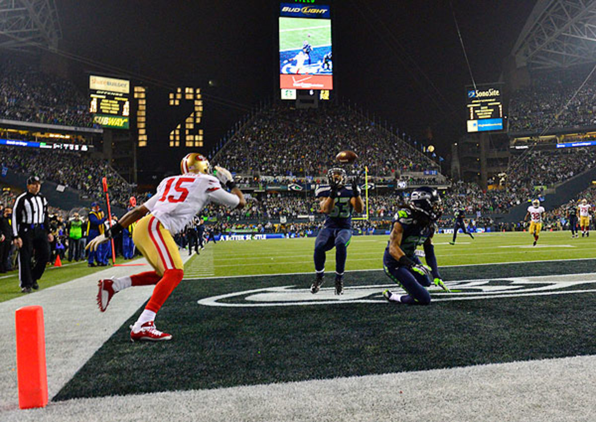 This pick from Malcolm Smith (center) sealed the Seahawks' win over the 49ers. 