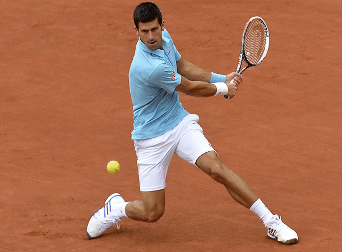 Andy Roddick has joined the chorus of analysts who think Novak Djokovic (above) will win the French Open. (Miguel Medina/AFP via Getty Images)