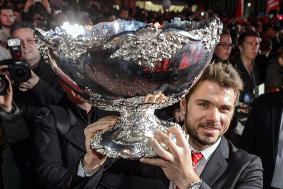 Wawrinka poses with the Davis Cup trophy in Lausanne.