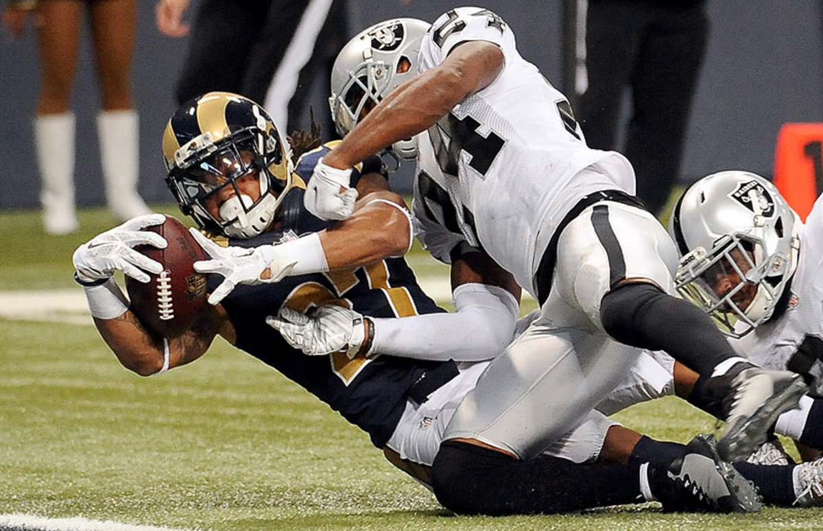 Tre Mason totaled 164 yards and three touchdowns in the Rams' 52-0 rout of the Raiders on Sunday. (L.G. Peterson/AP)