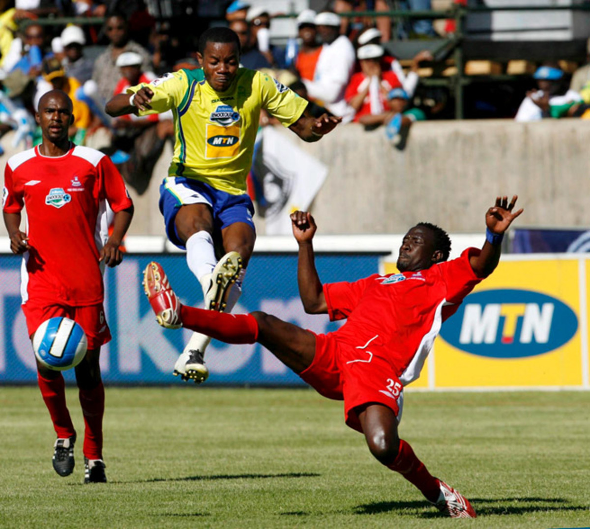 Patrick Apataki goes airborne for the Mamelodi Sundowns in 2007, donning the yellow and blue uniforms introduced by owner Zola Mahobe, who dubbed his team "The Brazilians."