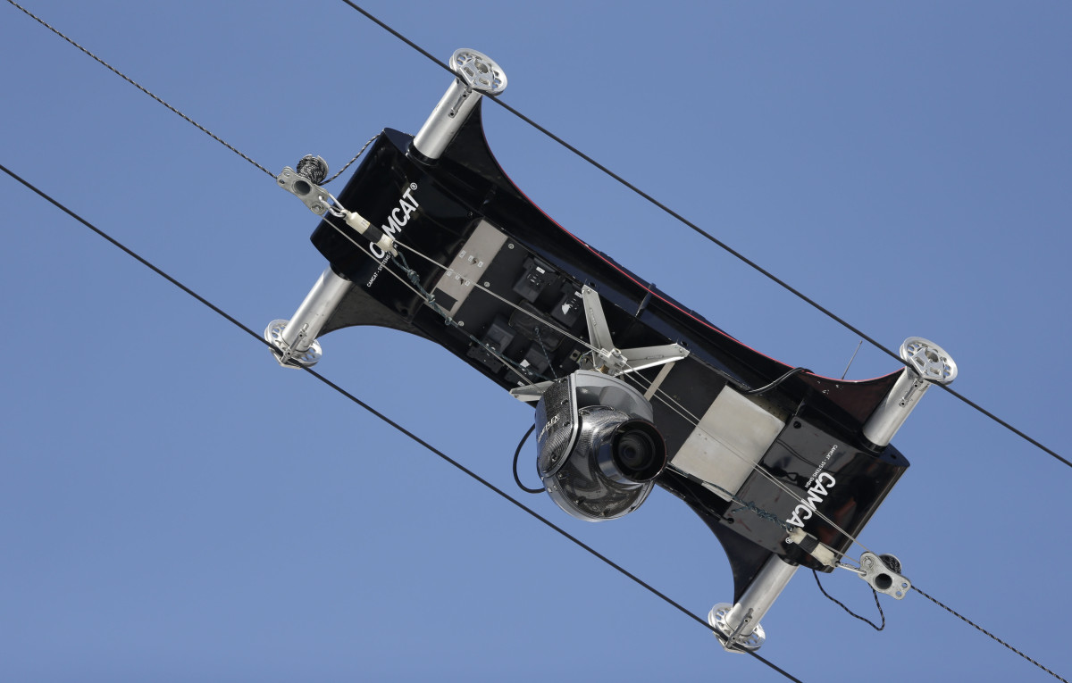 A spider camera records the Nordic combined training on Monday.