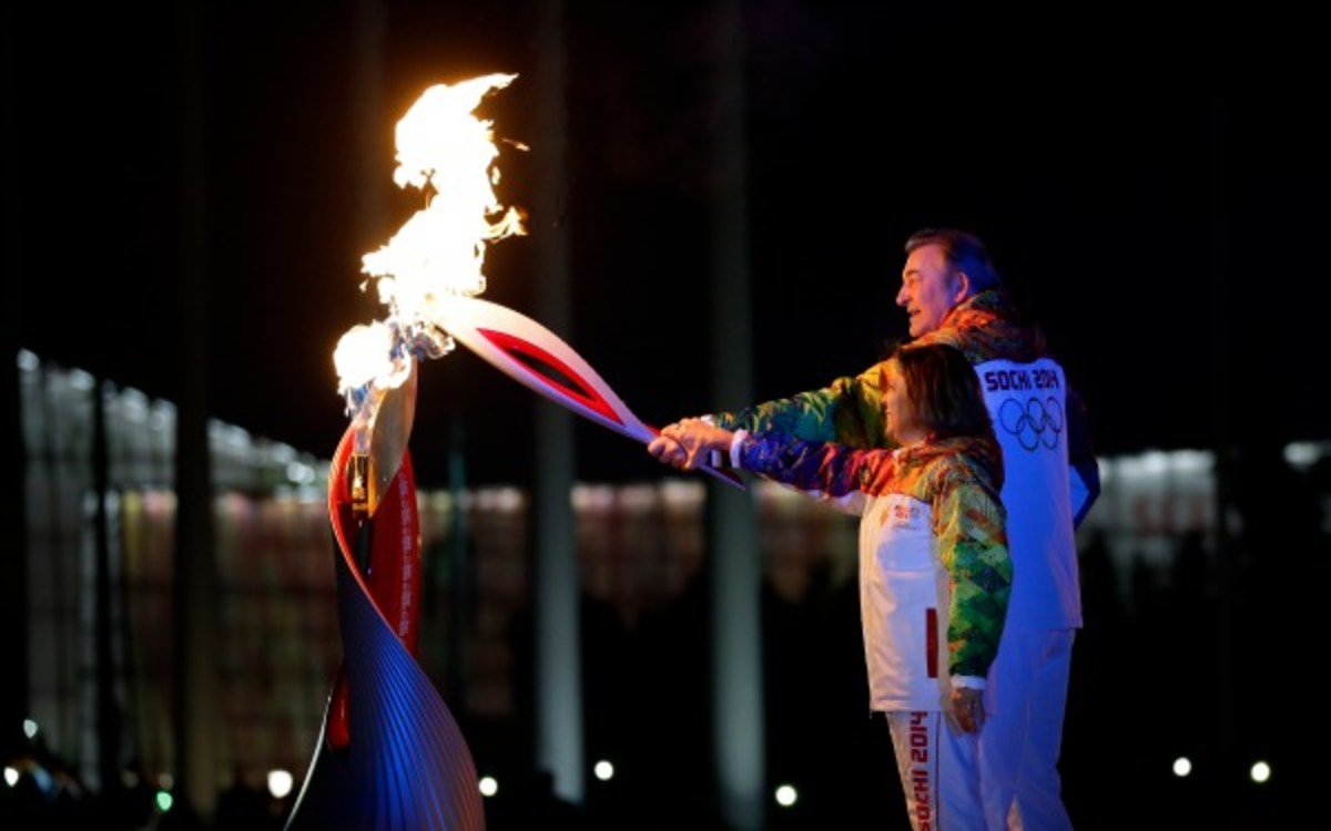 Irina Rodnina and Vladislav Tretyak light the cauldron during the opening ceremonies.  (AP Photo/Matt Slocum)