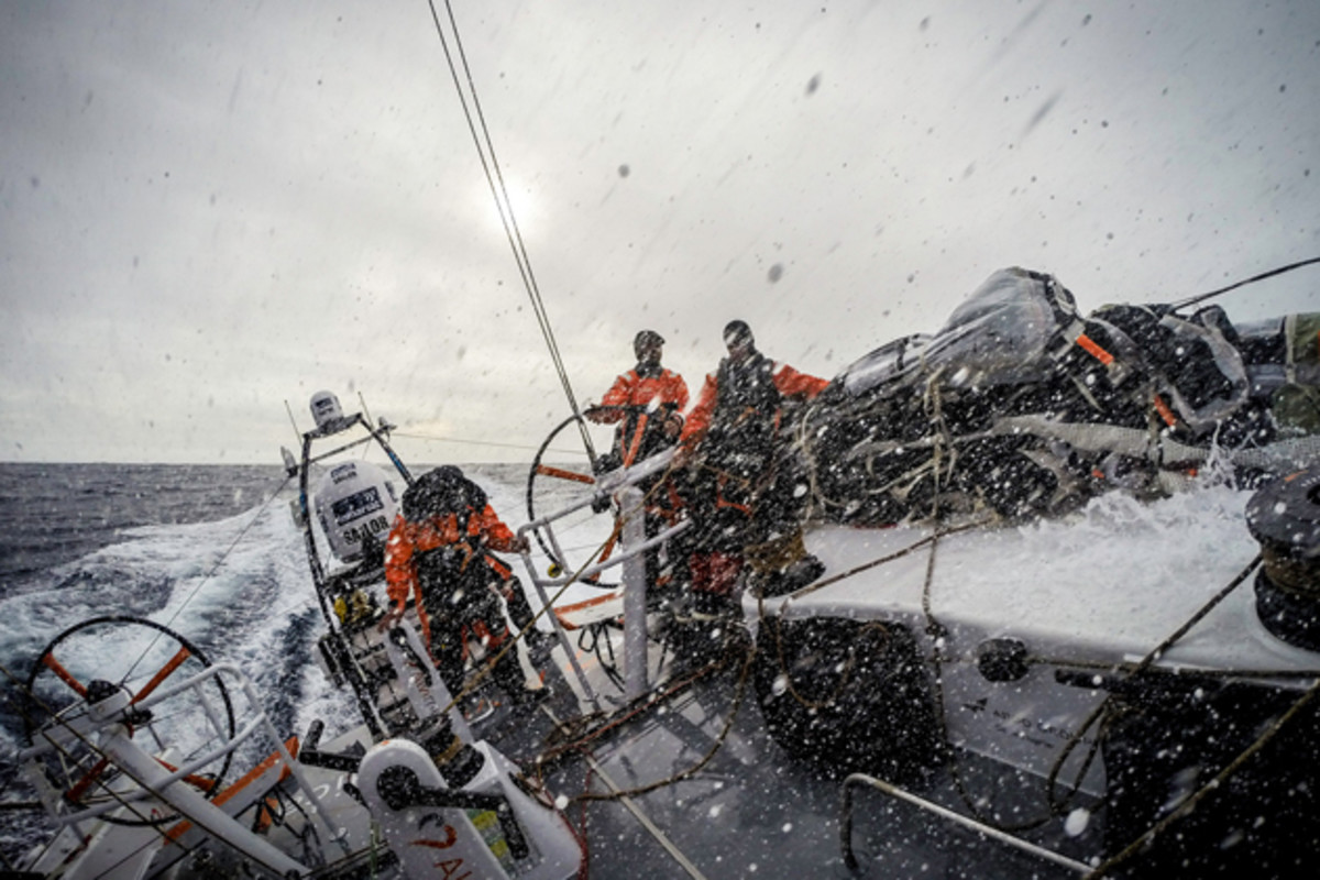 Constant spray across the deck in fast downwind sailing conditions.