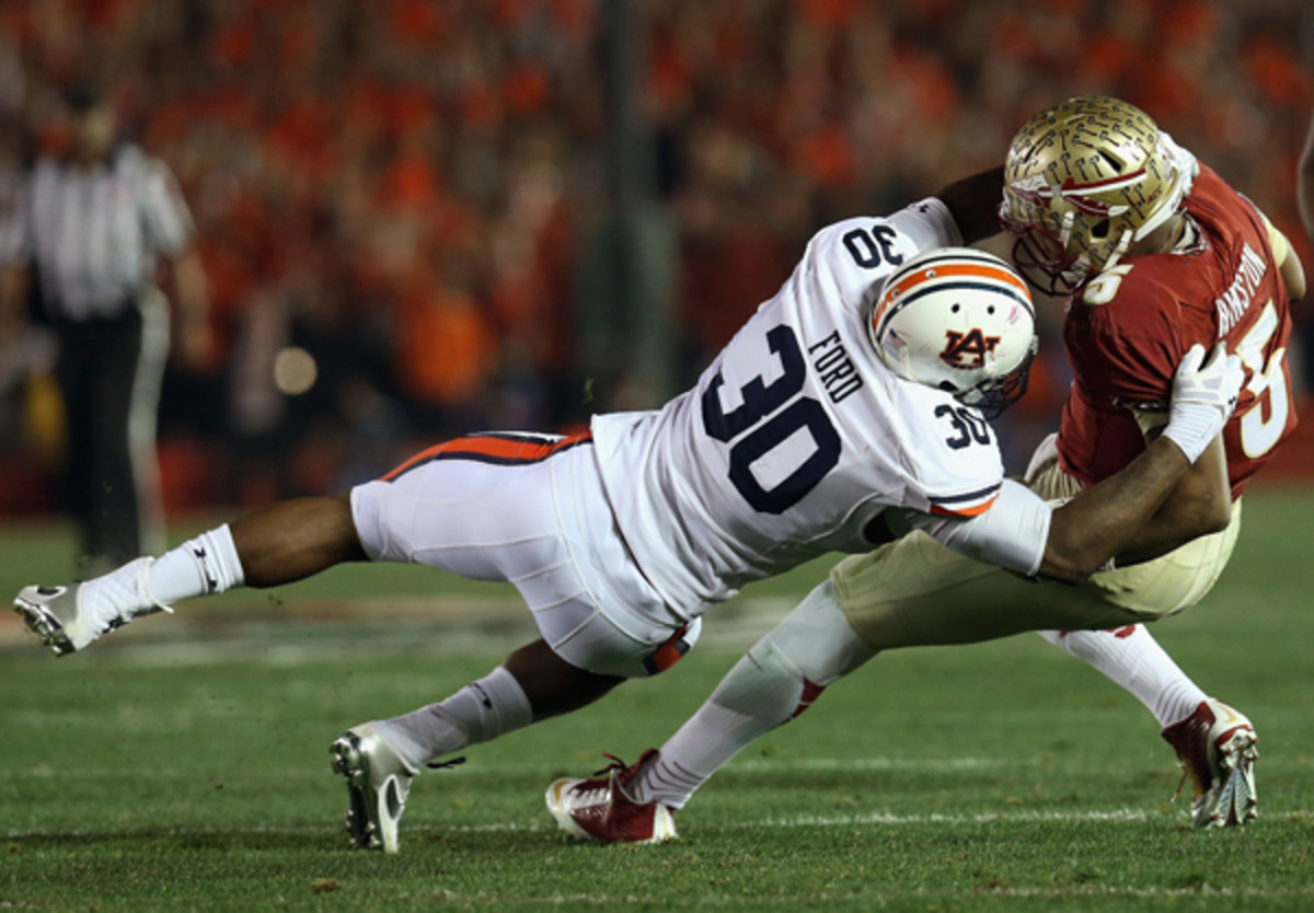Auburn's Dee Ford takes Florida State QB Jameis Winston down during the 2014 BCS Championship game. (Stephen Dunn/Getty Images)