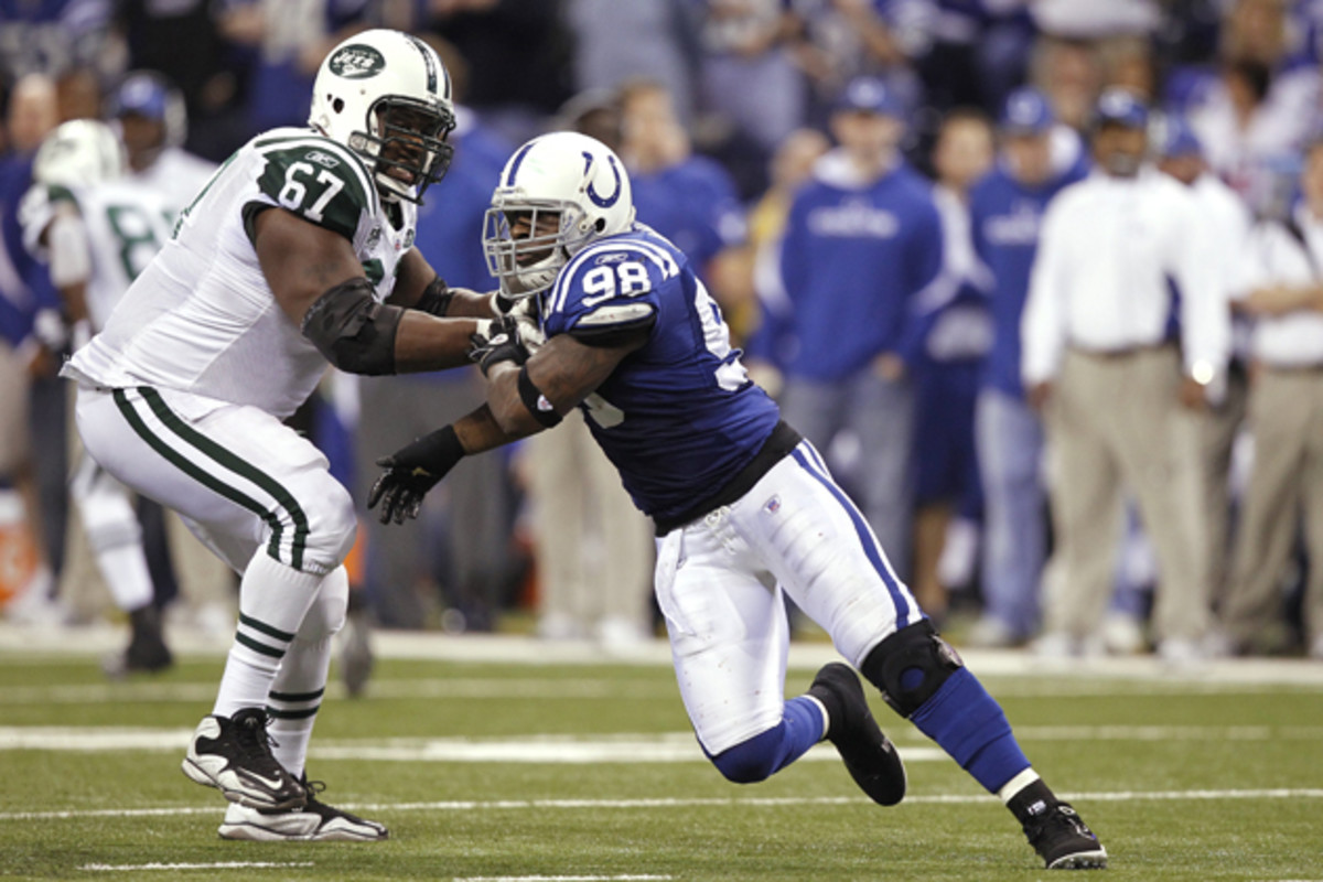 New York Jets defensive lineman Woody delivers a block in 2010 in Indianapolis, Indiana.