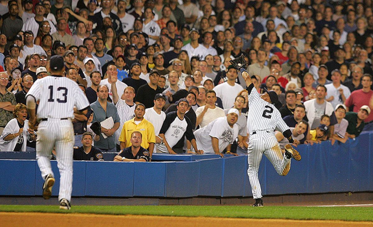 This catch in the 2004 playoffs ended with Jeter bloodied after a head-first dive into the stands. (Ezra Shaw/Getty Images)