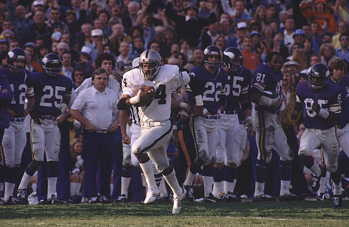 Among Brown's highlights in silver and black was this pick six in Super Bowl XI. (Heinz Kluetmeier/Sports Illustrated)