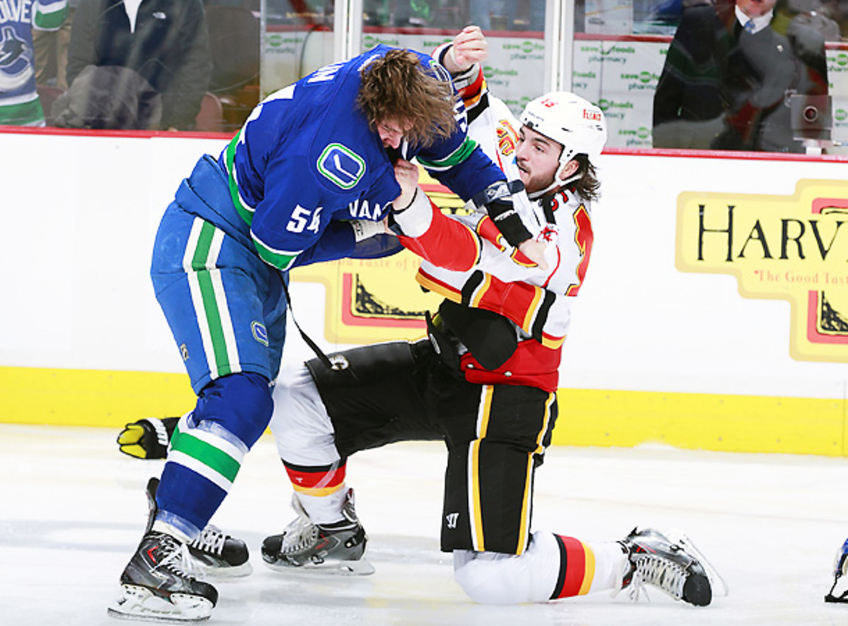 Kellan Lain (left) was ejected two seconds into his NHL debut after his role in Saturday's line brawl. (Jeff Vinnick/Getty)