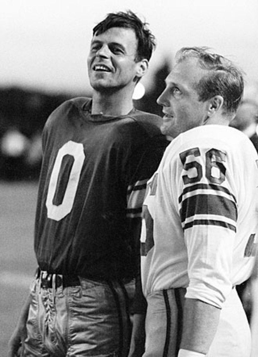 George Plimpton (left) could finally relax after defenders like Joe Schmidt were done having their way with him.