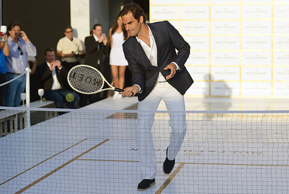 Roger Federer is so comfortable wearing a sports coat that he can even play tennis in one. (Gustavo Caballero/Getty Images for Moet & Chandon)
