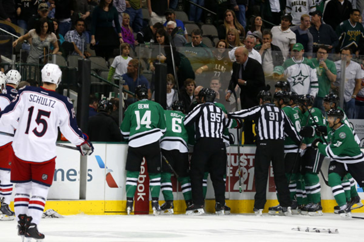 The Dallas Stars react after forward Rich Peverley collapsed on their bench.